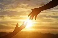 Hands reaching towards each other with sunshine in the background